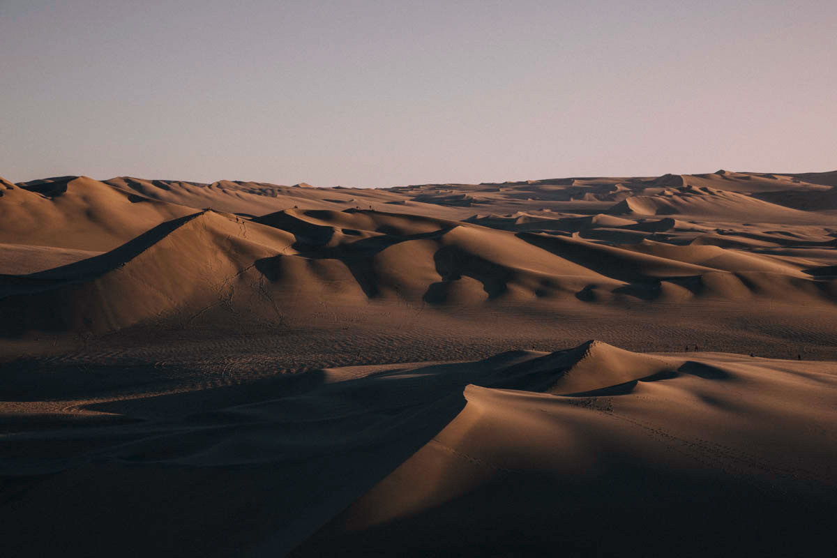 Sunset Huacachina oasis sand board desert